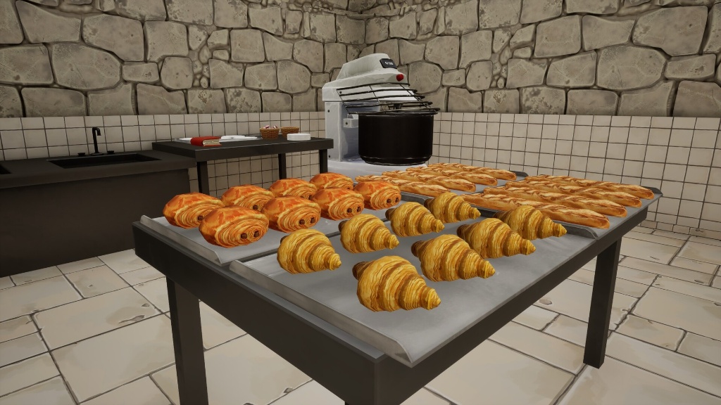 Table de boulangerie remplie de croissants, pains au chocolat et baguettes